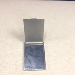 
                  
                    Women’s Compact Mirror. Closable, Labeled Women's Center at Riverview.
                  
                