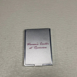 
                  
                    Women’s Compact Mirror. Closable, Labeled Women's Center at Riverview.
                  
                